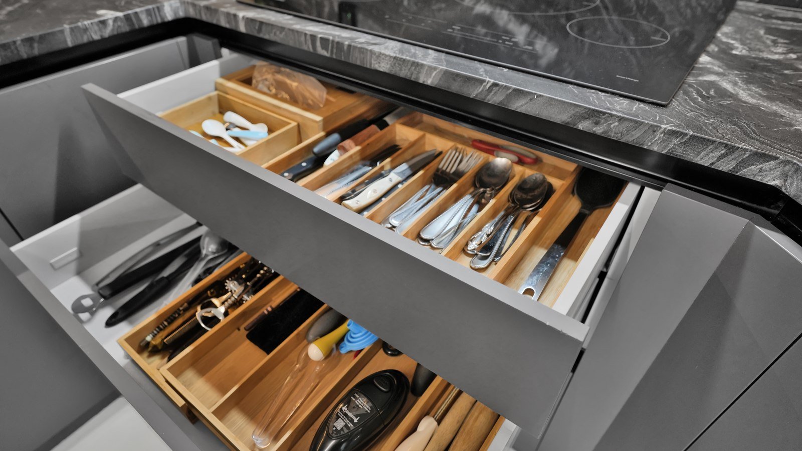 Organized kitchen drawer with built-in utensil dividers