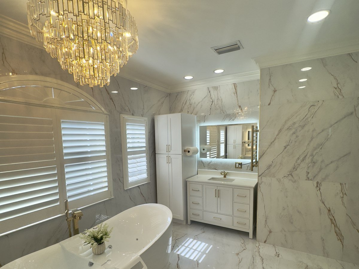 Traditional bathroom remodel with crystal chandelier and jetted soaking tub
